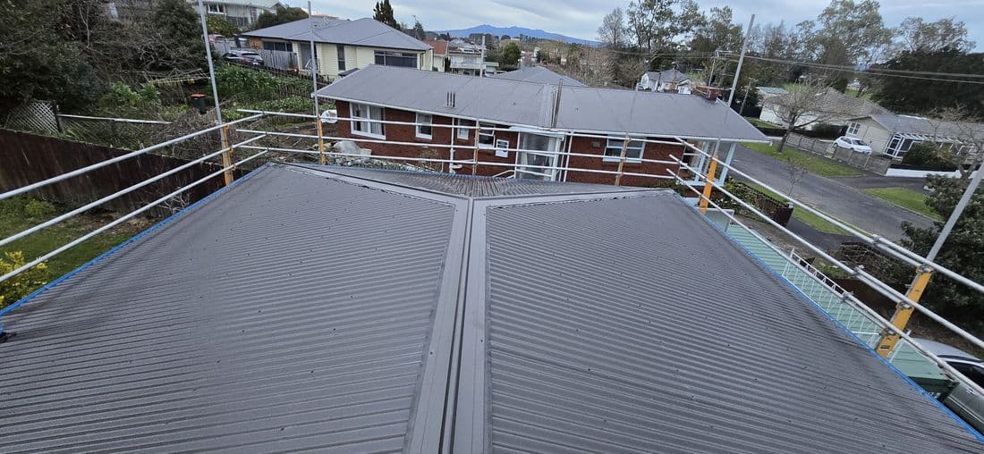 Wide new long-run roof with a view across the Waikato