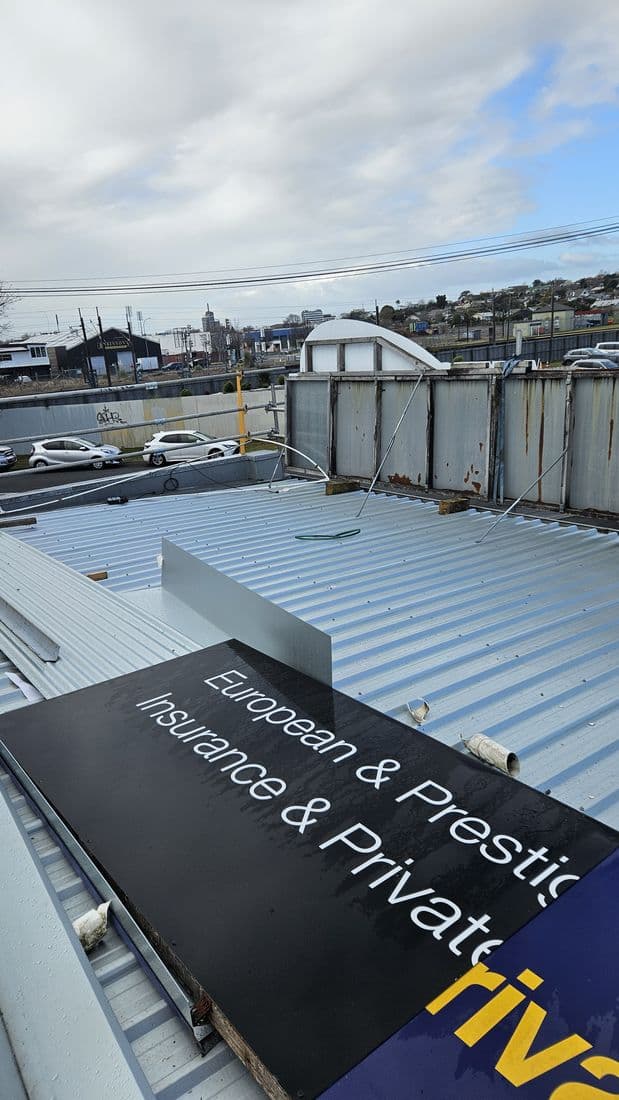 Commercial roof with parapet and signage