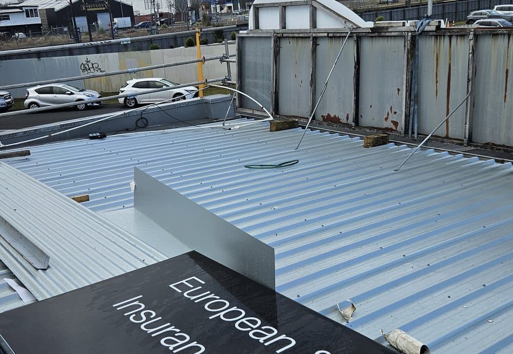 Large long-run steel roof on a commercial building